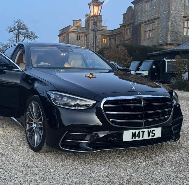 Black Mercedes S Class parked outside